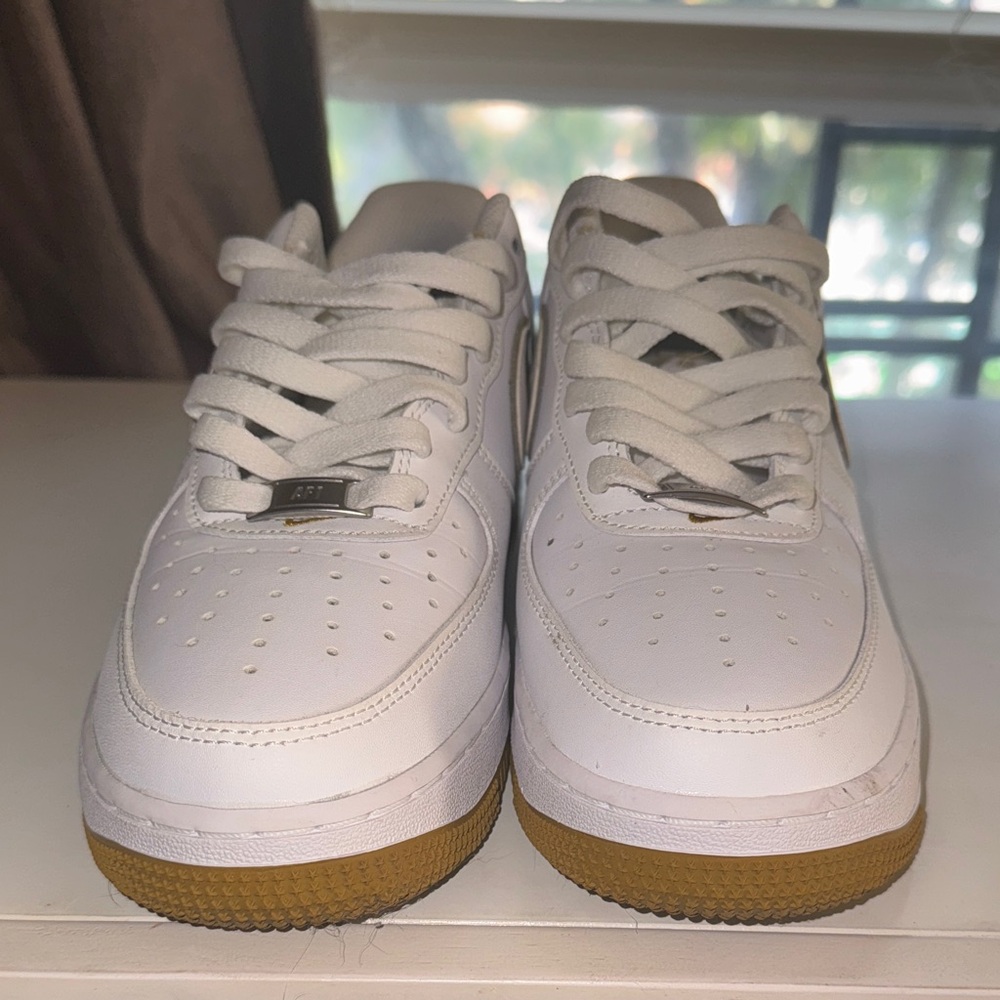 White Athletic Shoes with Gold Accents
